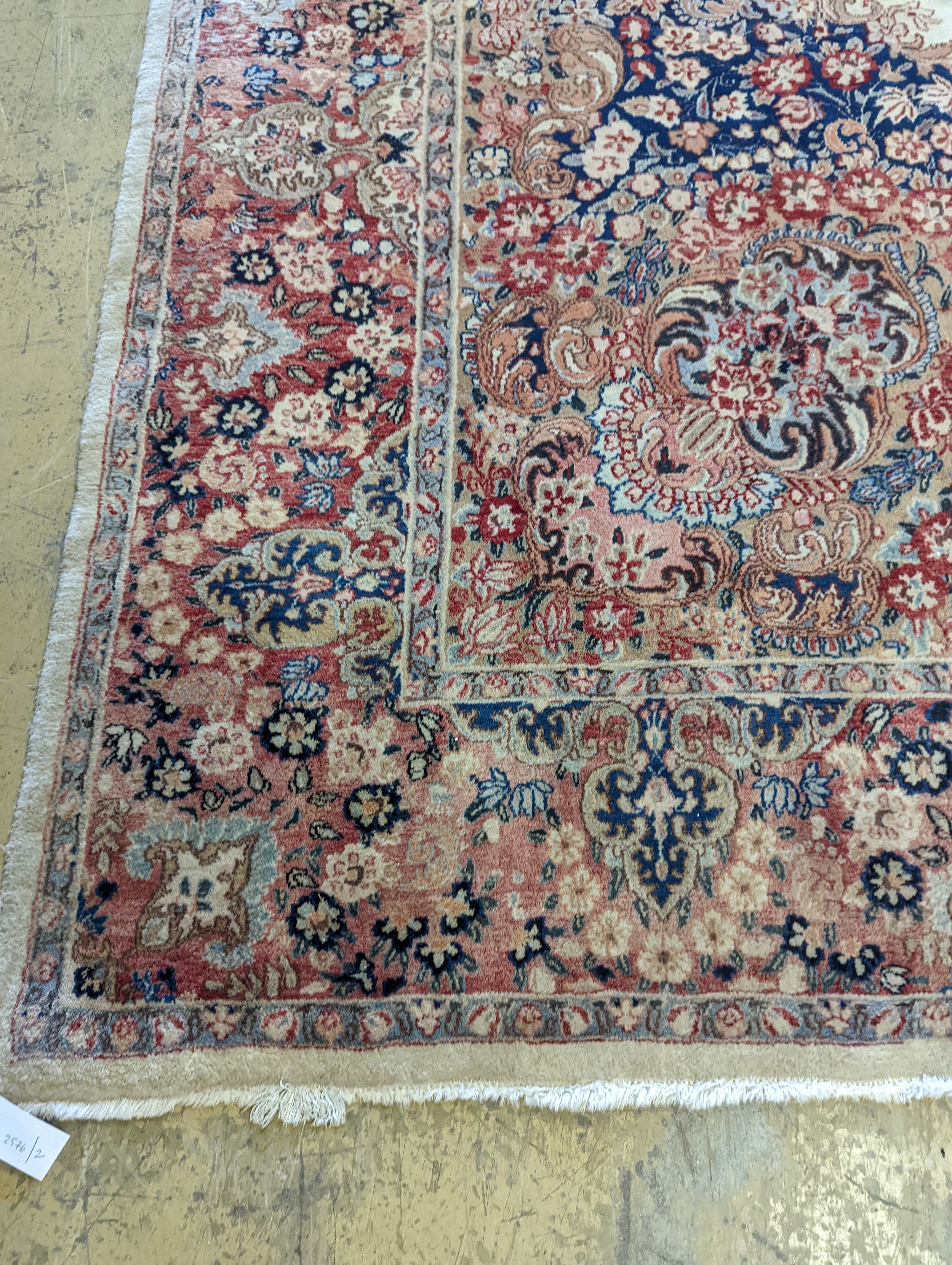 A North West Persian ivory ground carpet, 410 x 310cm